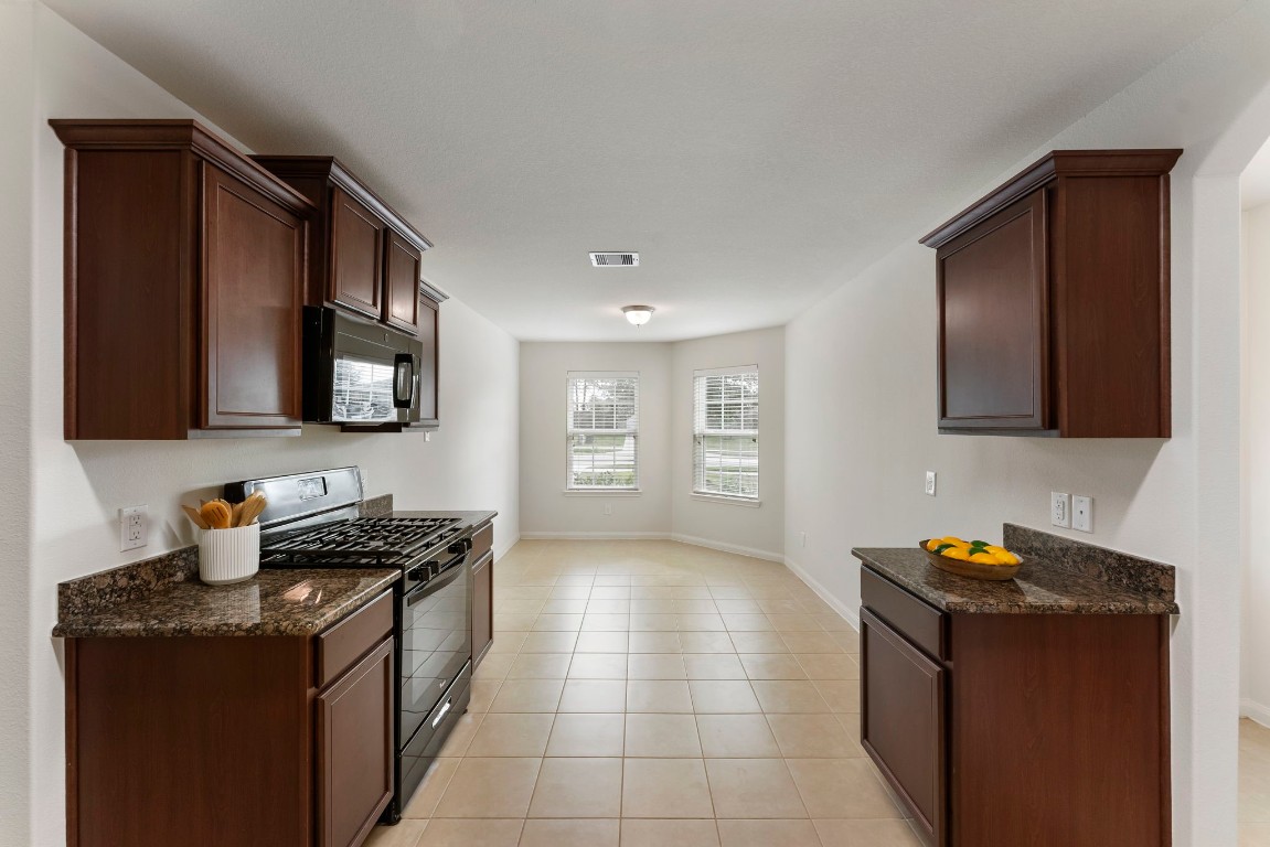 9159 Nina Road Conroe, TX 77304 - Photo 6 of 24 The kitchen is joined with the breakfast room.