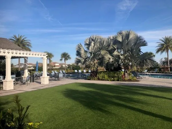 a view of a park with swings and slides