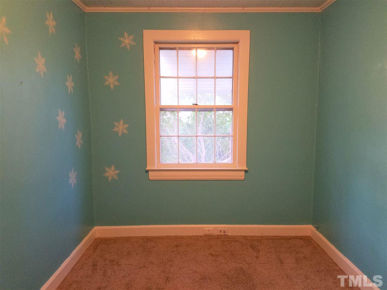 3105 East Garner Road Raleigh, NC 27610 - Photo 13 of 18 an empty room with a window