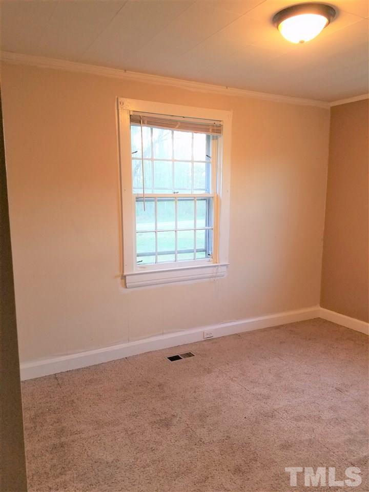 3105 East Garner Road Raleigh, NC 27610 - Photo 14 of 18 an empty room with a window