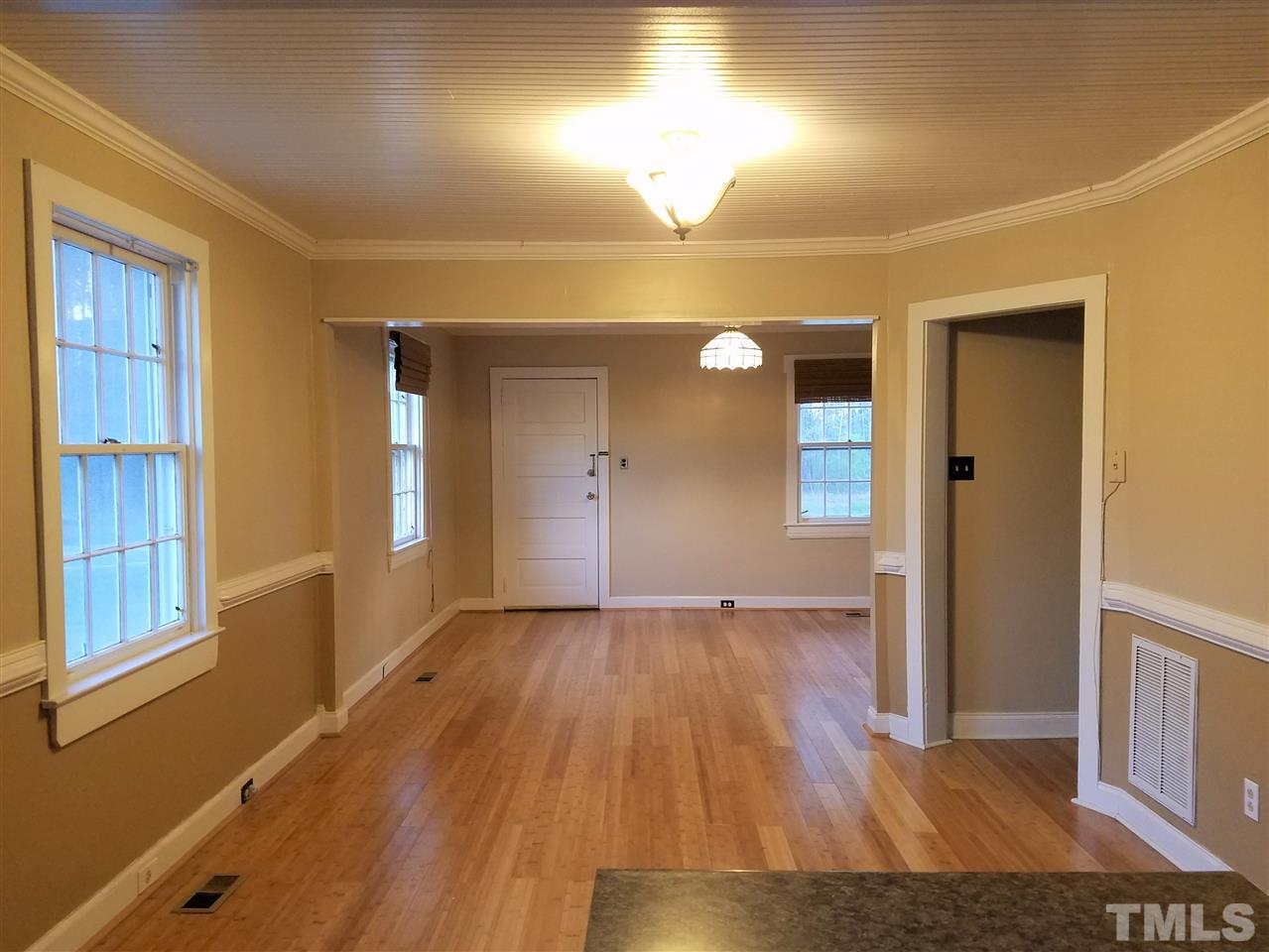 3105 East Garner Road Raleigh, NC 27610 - Photo 6 of 18 wooden floor in an empty room with a window