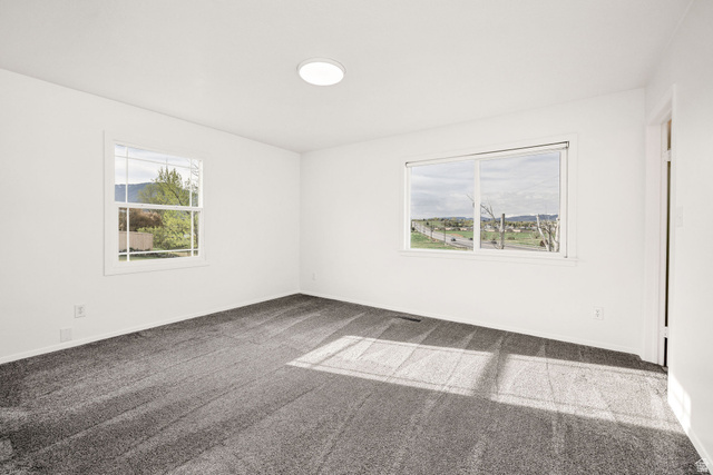 4155 Johnson Road Nibley, UT 84321 - Photo 26 of 71 Empty room featuring carpet flooring and baseboards