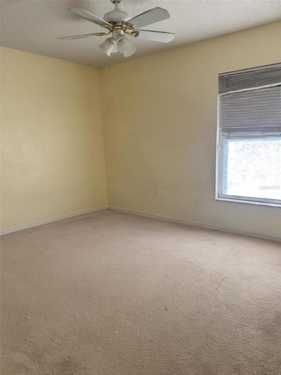 702 Tartan Loop Lake Wales, FL 33853 - Photo 15 of 20 an empty room with a window