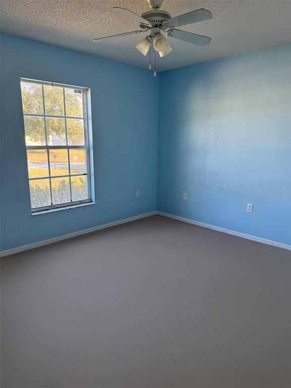 702 Tartan Loop Lake Wales, FL 33853 - Photo 17 of 20 an empty room with a window