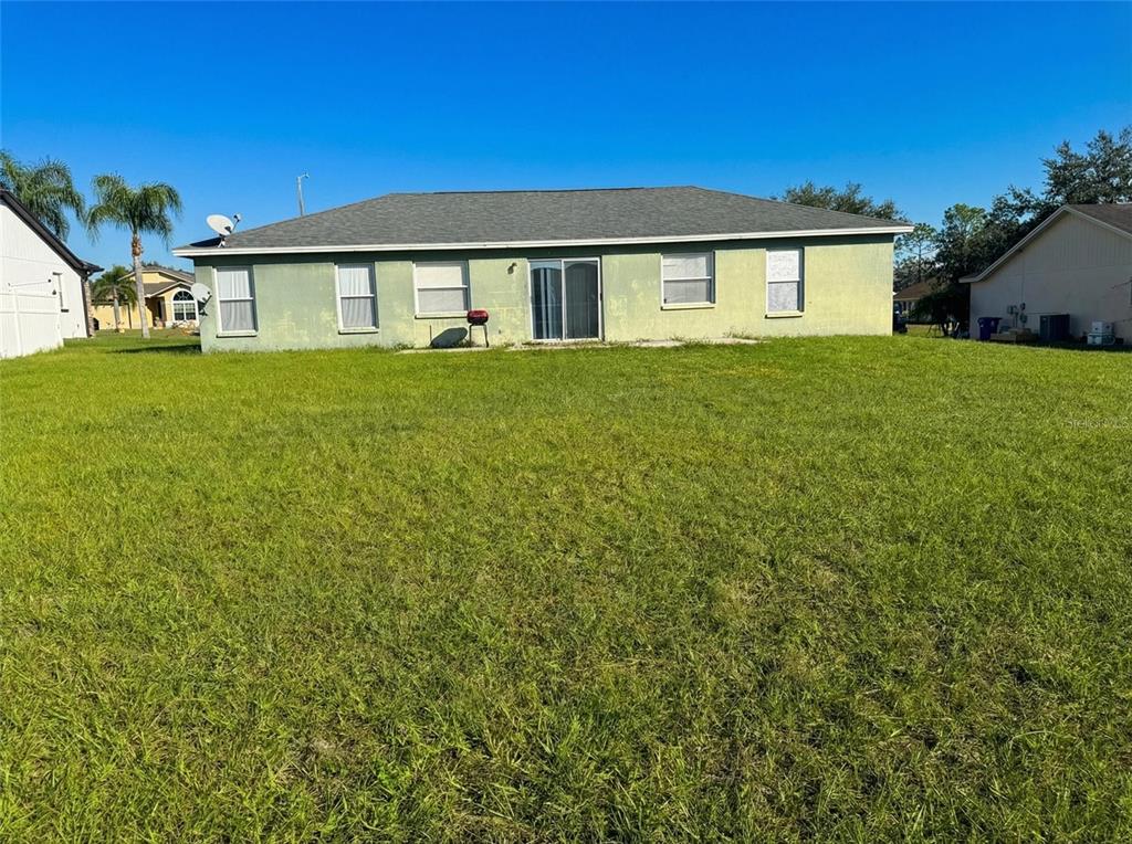 702 Tartan Loop Lake Wales, FL 33853 - Photo 20 of 20 a front view of a house with garden