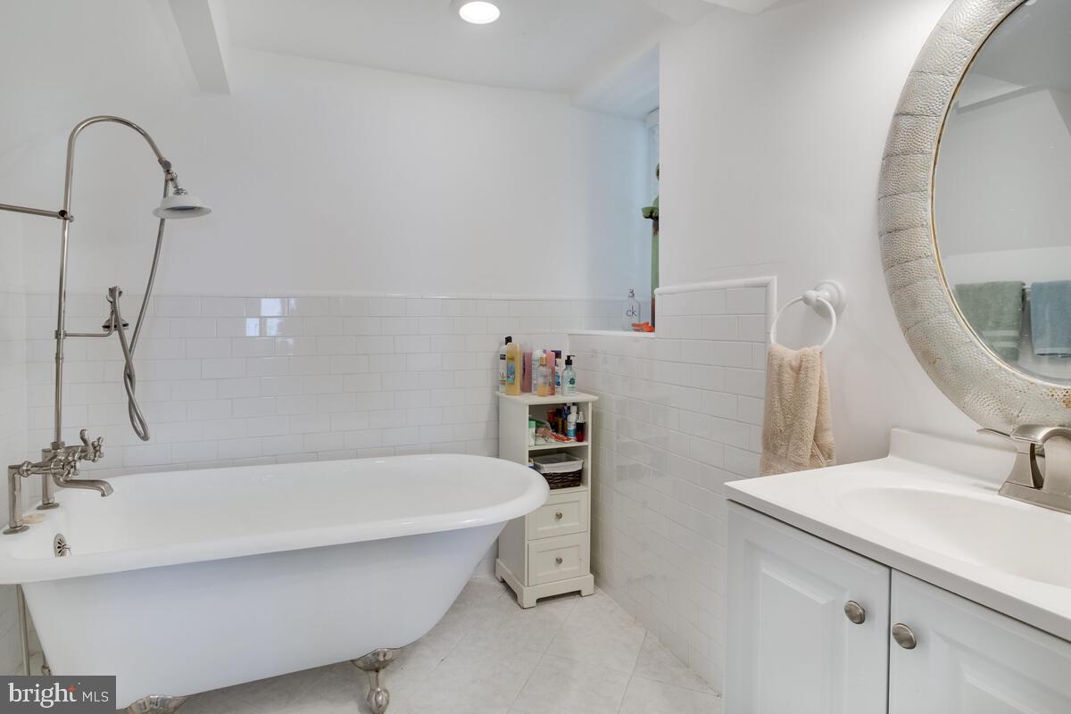 2144 Cedar Road Port Republic, MD 20676 - Photo 44 of 56 a bathroom with a sink and a mirror