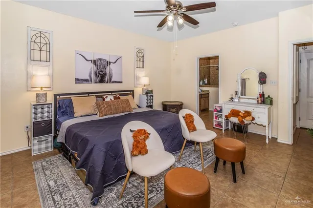 a bed room with a bed and a chair