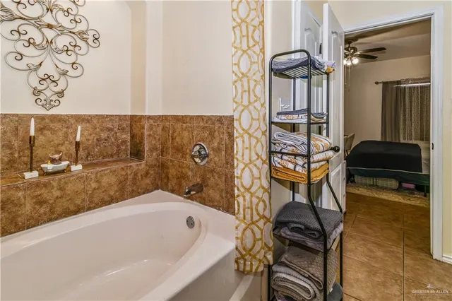 a bathroom with a bathtub and a shower