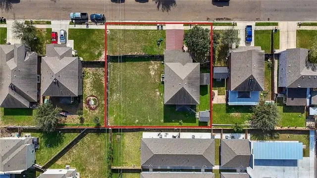 an aerial view of a house with a garden and outdoor space