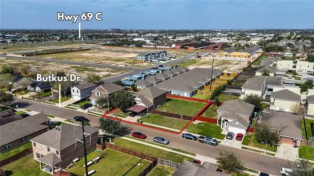 an aerial view of residential houses with outdoor space