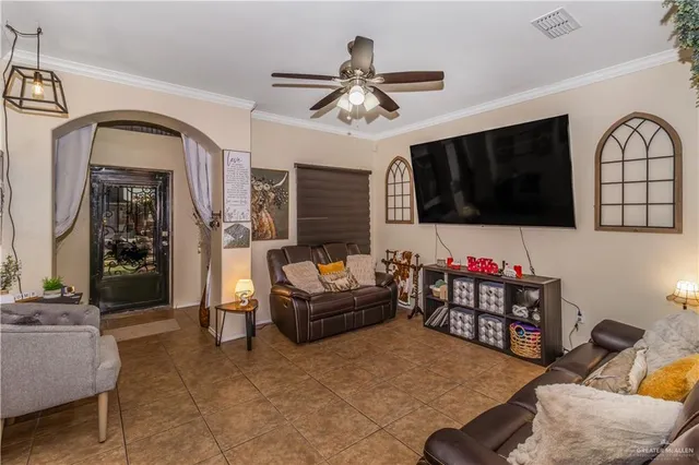 a living room with fireplace furniture and a flat screen tv