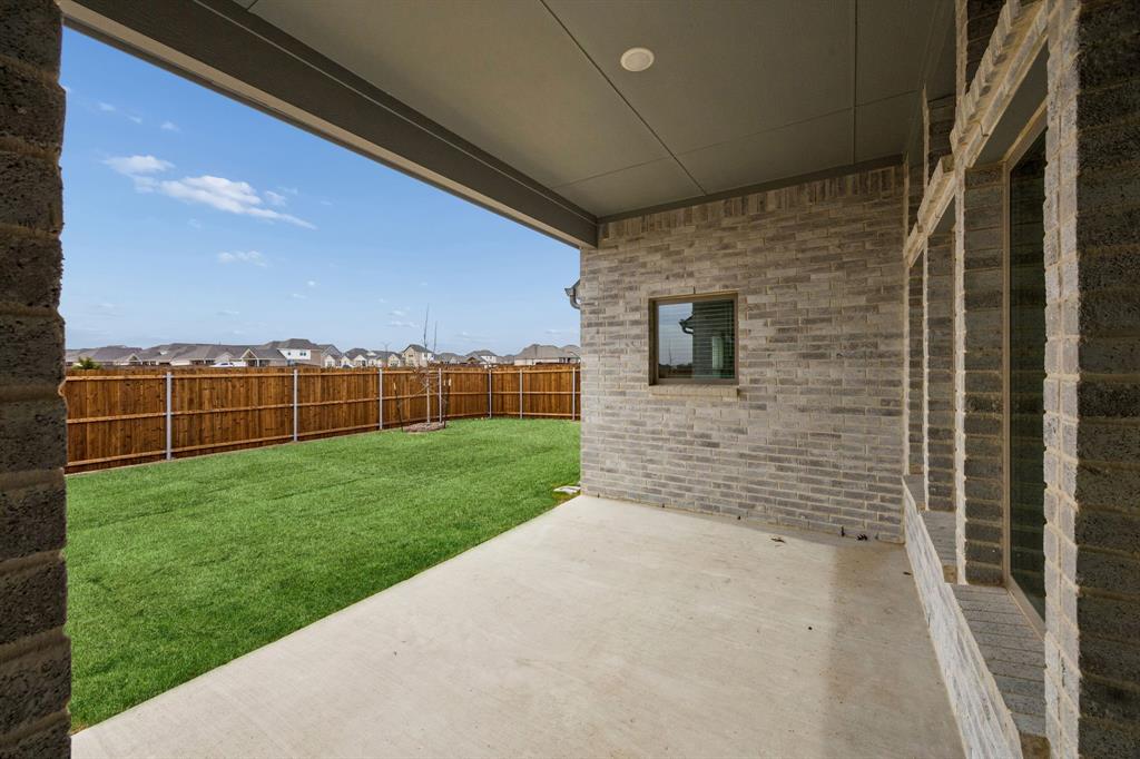 2121 Sunshining Road Princeton, TX 75407 - Photo 34 of 40 Covered Patio in the Gilmour II home plan by Trophy Signature Homes – REPRESENTATIVE PHOTO