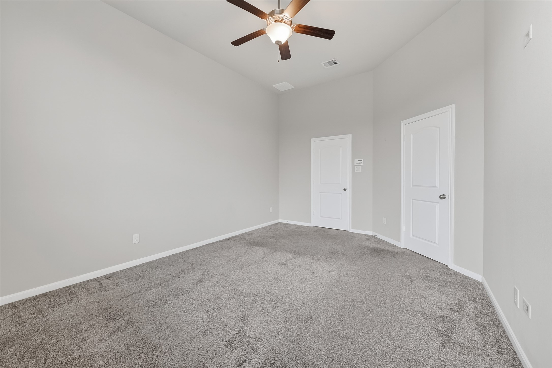 16226 Rattlesnake Run Trail Cypress, TX 77433 - Photo 18 of 29 an empty room with ceiling fan and window