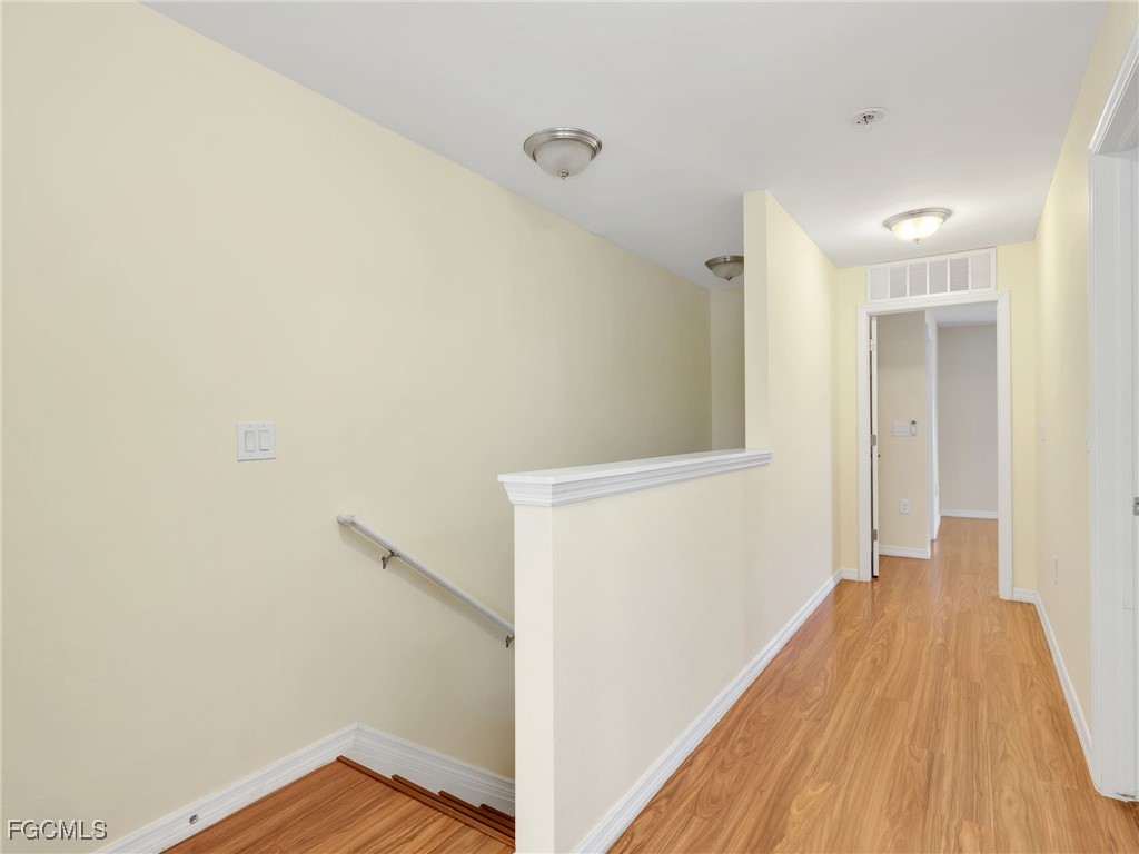 3886 Tilbor Circle Fort Myers, FL 33916 - Photo 18 of 30 a view of hallway with wooden floor