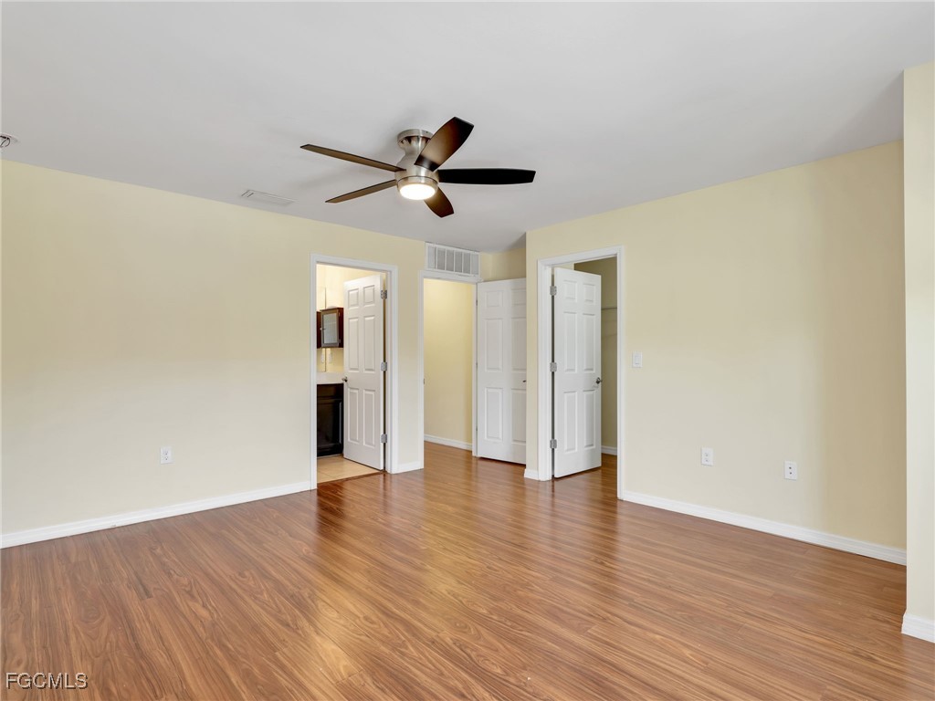 3886 Tilbor Circle Fort Myers, FL 33916 - Photo 24 of 30 a view of an empty room with wooden floor