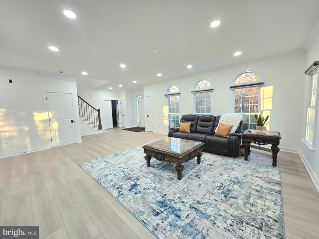 a bathroom with a washing machine and a mirror