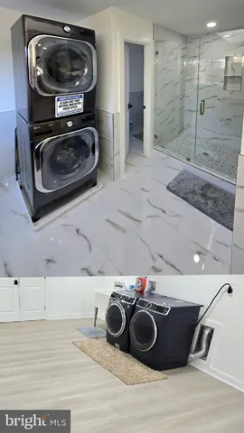 a bathroom with a granite countertop sink mirror and shower
