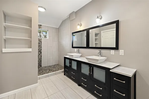 a bathroom with a sink and a mirror