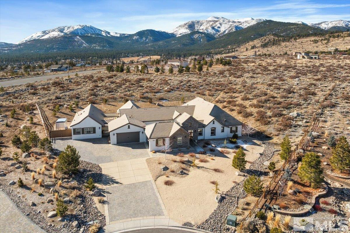 a view of a town with mountains in the background