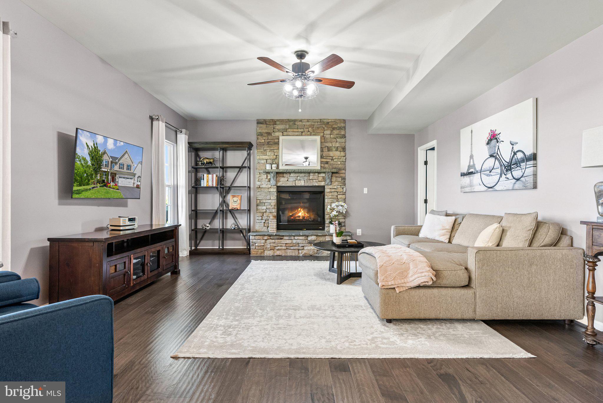 25849 Racing Sun Drive Aldie, VA 20105 - Photo 18 of 80 Family Room with stacked stone Gas Fireplace