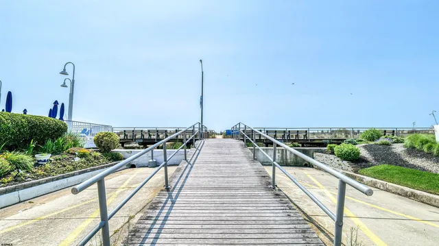 a view of a swimming pool with outdoor seating
