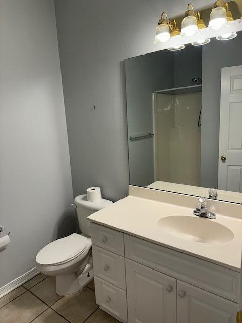 1501 Partin Drive North, Unit 164 Niceville, FL 32578 - Photo 13 of 23 a bathroom with a sink a toilet and mirror