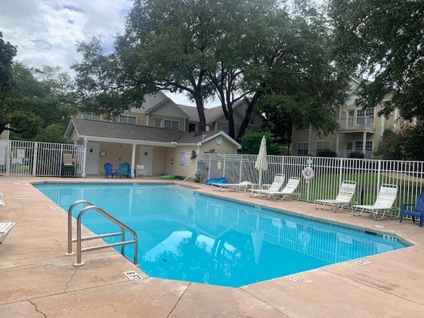 1501 Partin Drive North, Unit 164 Niceville, FL 32578 - Photo 22 of 23 a view of a house with a swimming pool