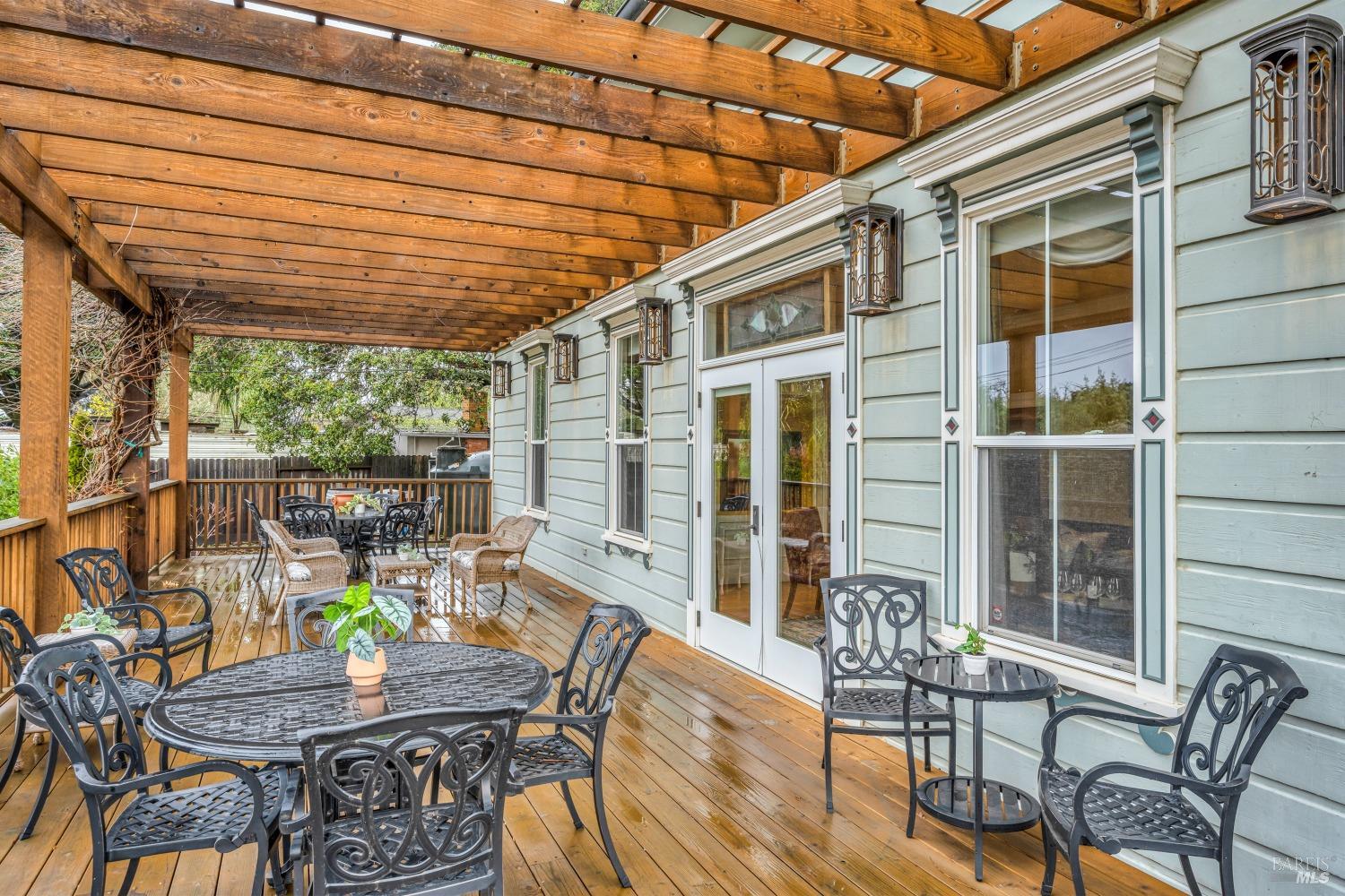 129 Devlin Road Napa, CA 94558 - Photo 11 of 38 a view of a patio with table and chairs and potted plants