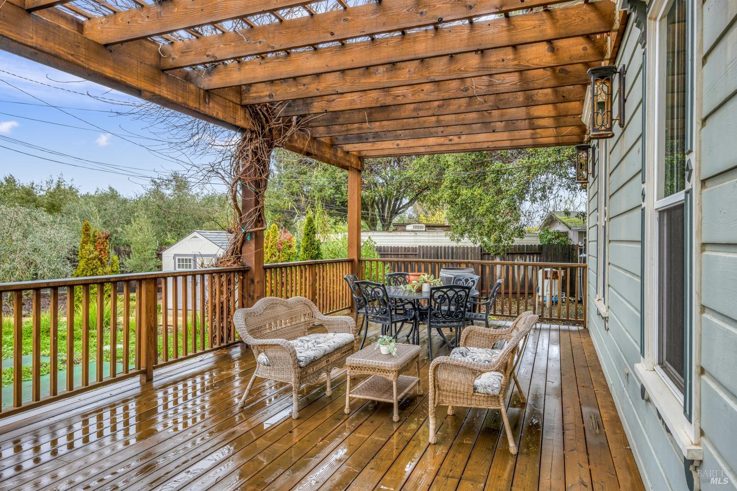 129 Devlin Road Napa, CA 94558 - Photo 12 of 38 a view of balcony with furniture and wooden floor