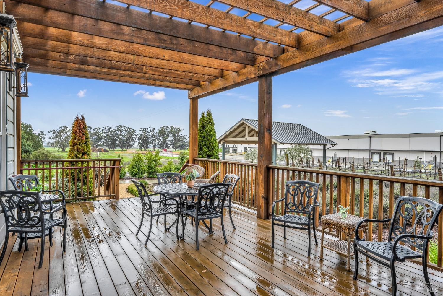 129 Devlin Road Napa, CA 94558 - Photo 13 of 38 a view of balcony with furniture and wooden floor