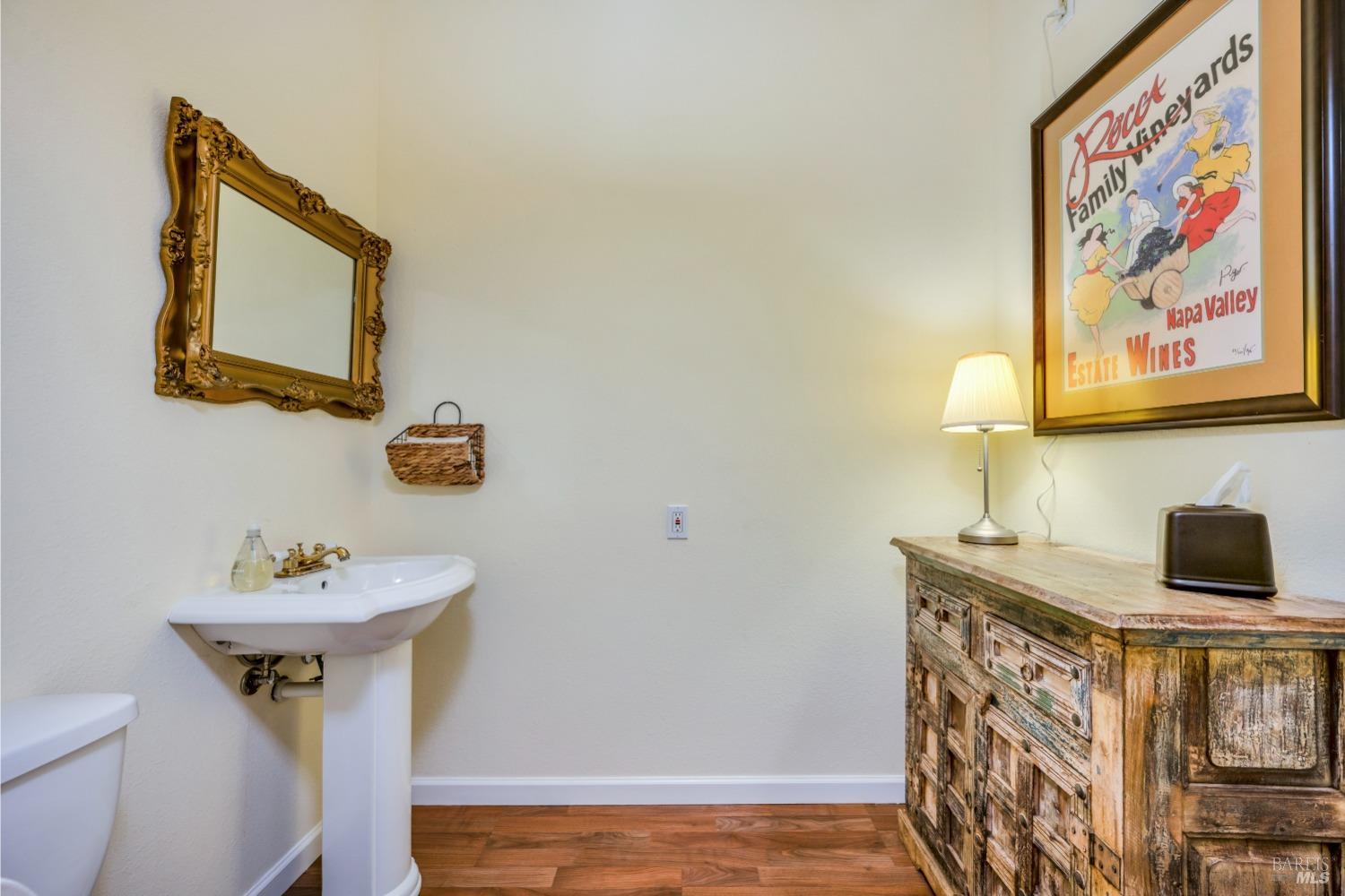 129 Devlin Road Napa, CA 94558 - Photo 23 of 38 a bathroom with a sink and a mirror