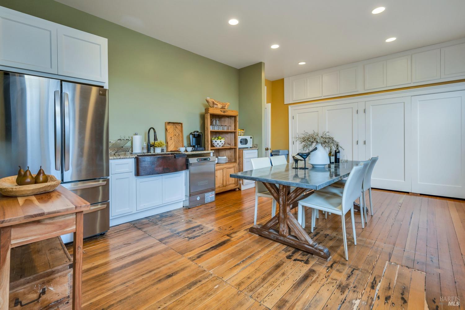 129 Devlin Road Napa, CA 94558 - Photo 26 of 38 a view of a dining room with furniture and wooden floor