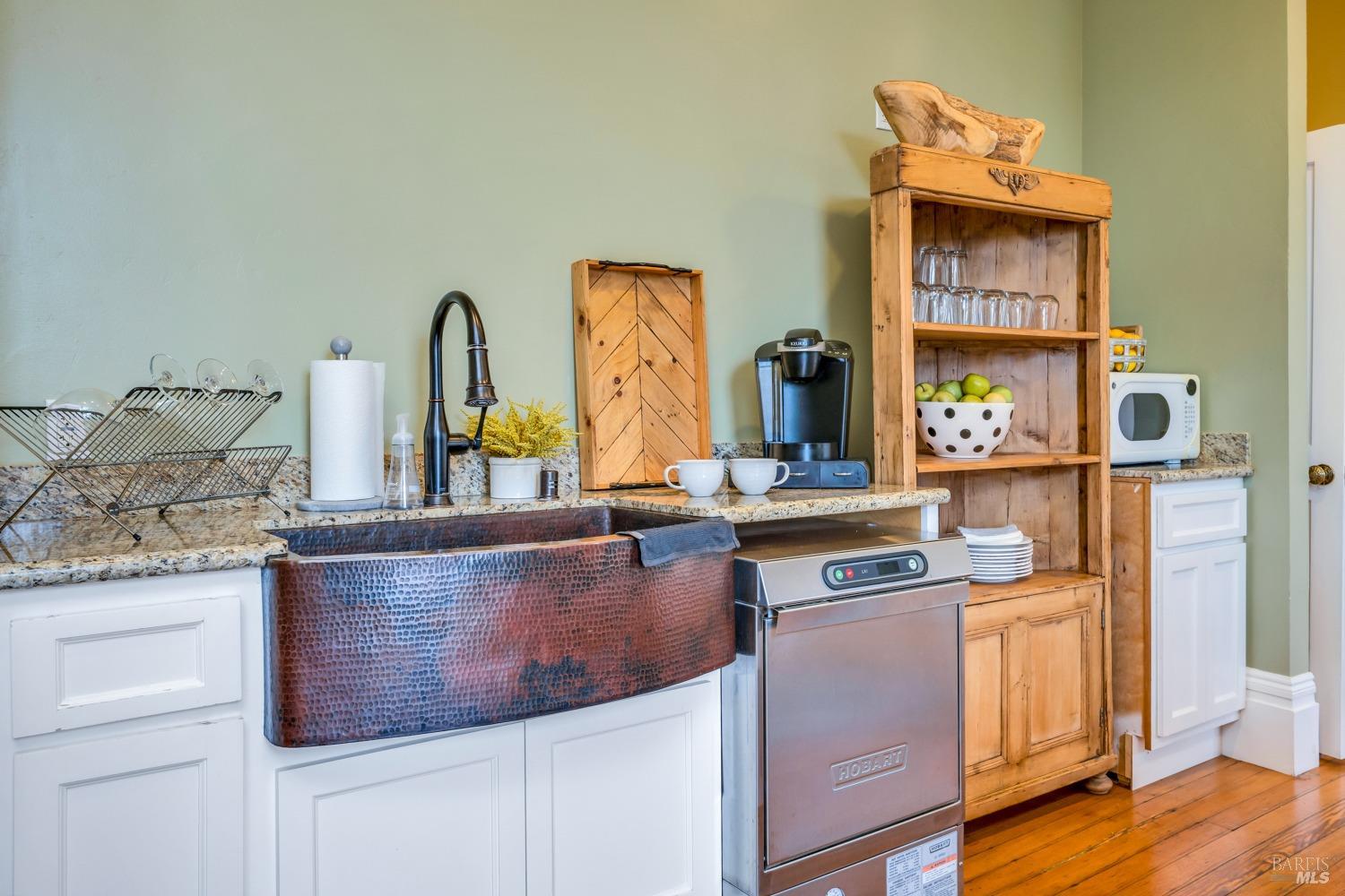 129 Devlin Road Napa, CA 94558 - Photo 27 of 38 a kitchen with stainless steel appliances granite countertop a stove and a wooden cabinets