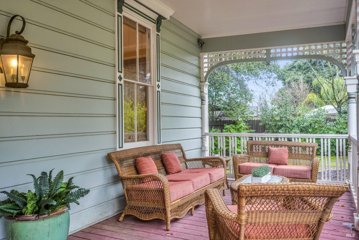 129 Devlin Road Napa, CA 94558 - Photo 3 of 38 a balcony with furniture and a potted plant