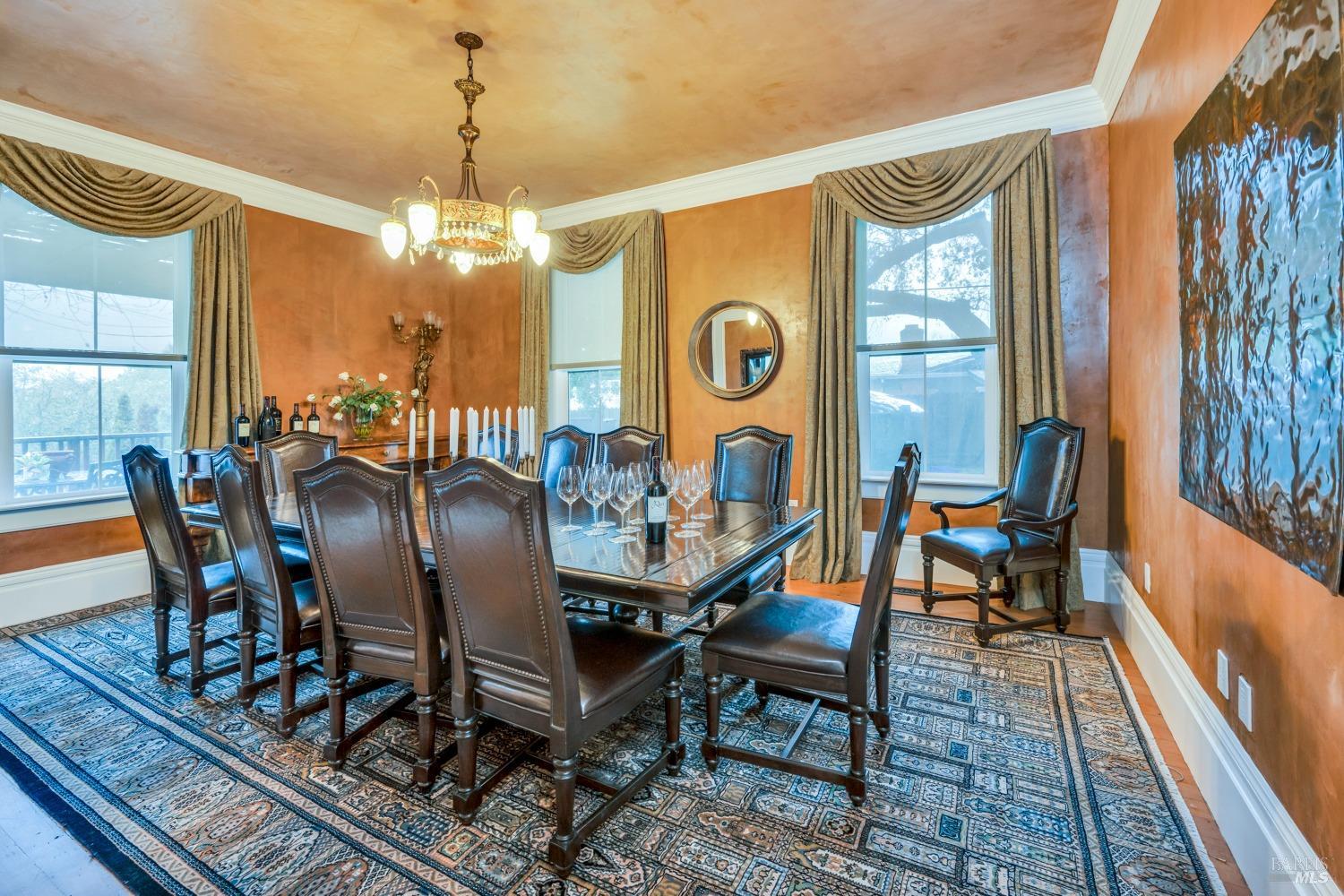 129 Devlin Road Napa, CA 94558 - Photo 4 of 38 a dining room with furniture a chandelier and wooden floor