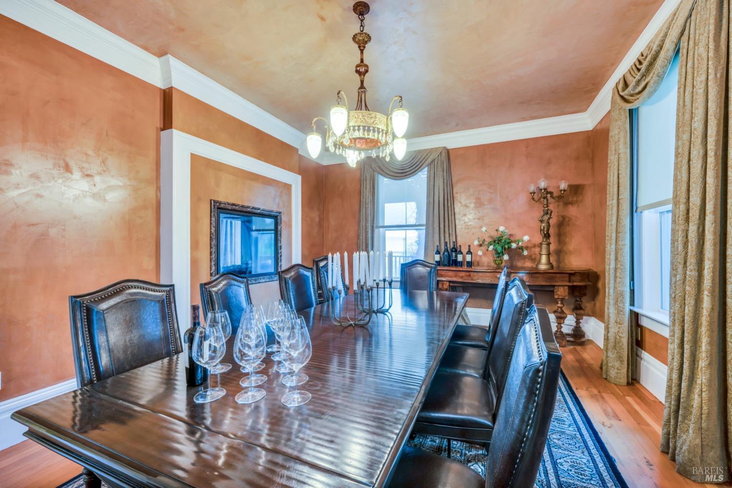 129 Devlin Road Napa, CA 94558 - Photo 6 of 38 a view of a dining room with furniture a chandelier and wooden floor