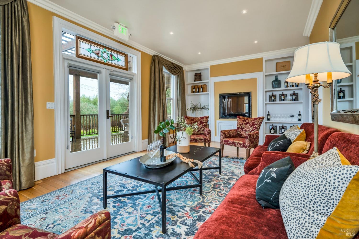 129 Devlin Road Napa, CA 94558 - Photo 10 of 38 a living room with furniture fireplace and a table
