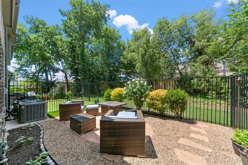 a view of a backyard with sitting area