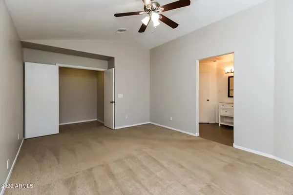 a view of an empty room with a fan