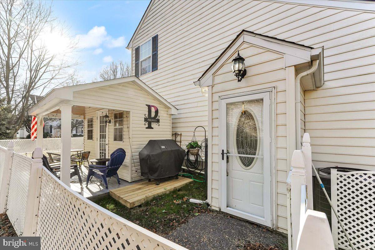 a view of a house with a porch and furniture