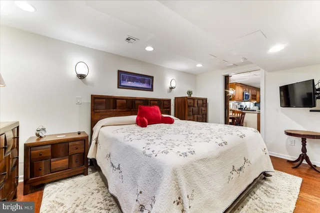 a bed room with a bed and a television