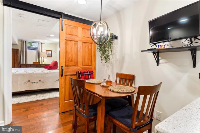 a view of a dining room with furniture window and wooden floor