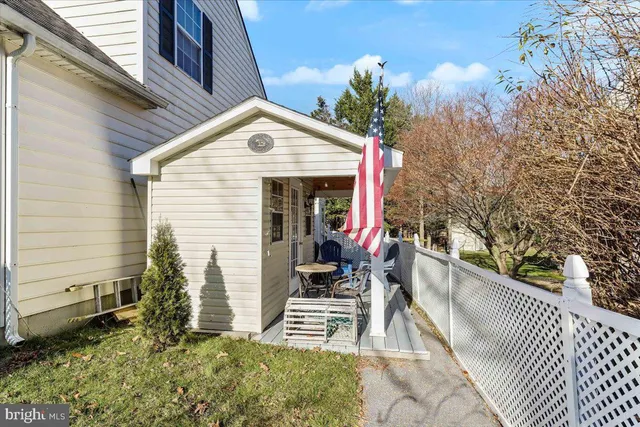 a view of a chair and tables in the balcony