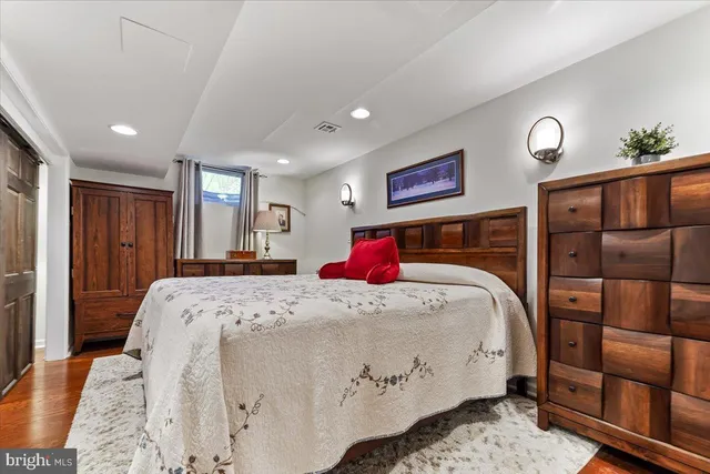 a bedroom with a bed and a closet