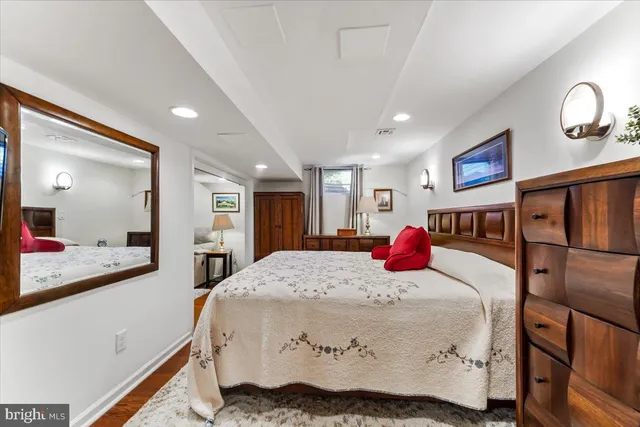 a bedroom with a bed and a dresser