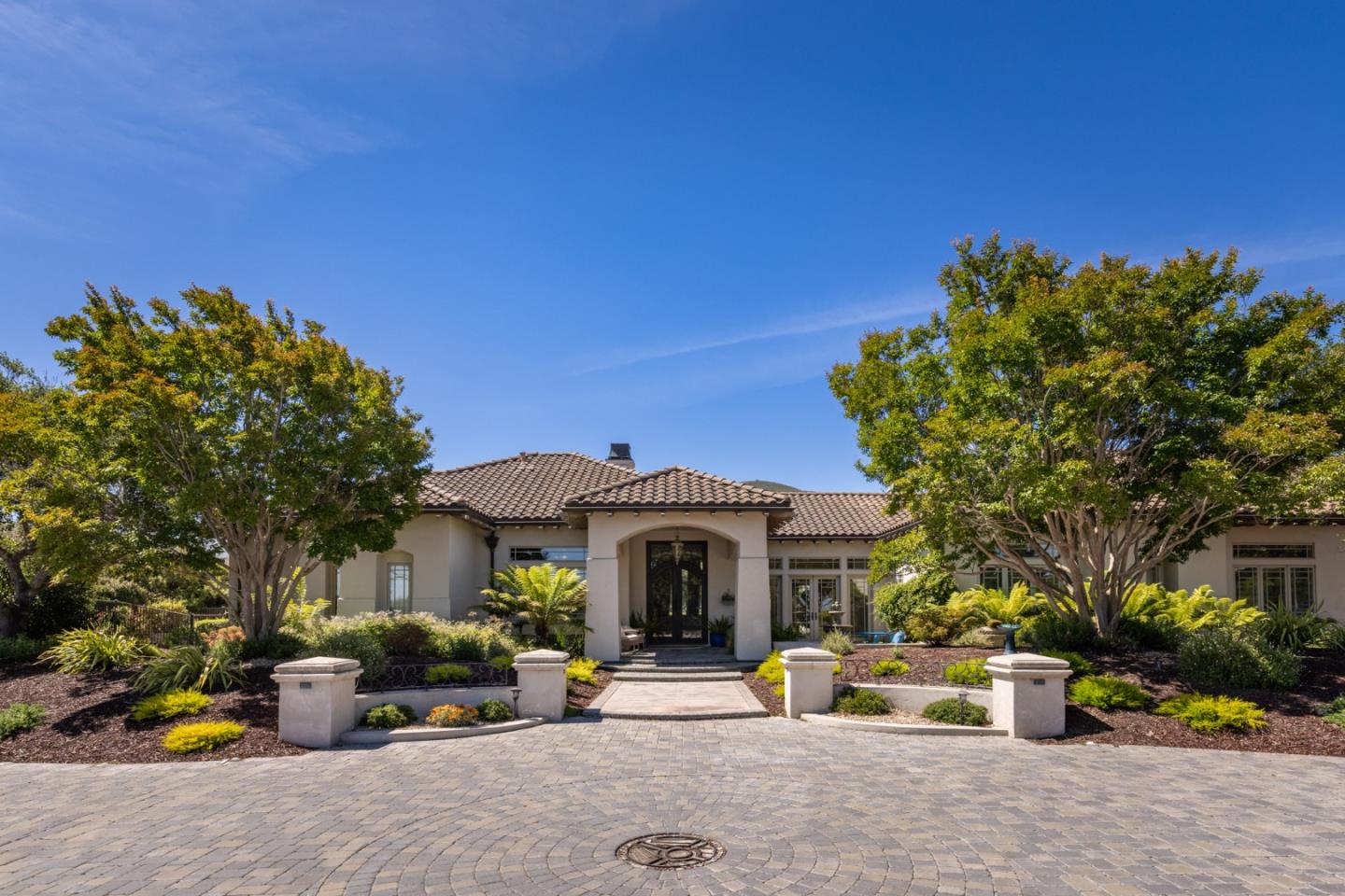 19831 Spring Ridge Terrace Salinas, CA 93908 - Photo 2 of 49 a front view of a house with a garden