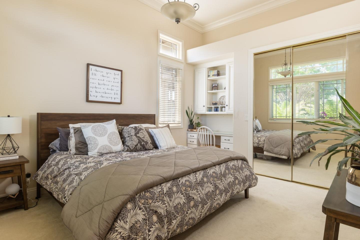 19831 Spring Ridge Terrace Salinas, CA 93908 - Photo 23 of 49 a bedroom with a large bed and a large window