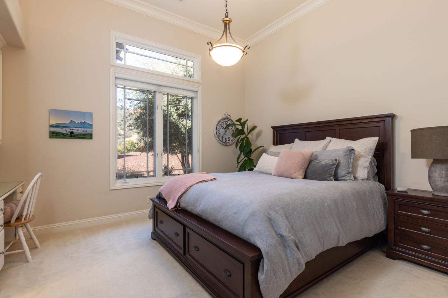 19831 Spring Ridge Terrace Salinas, CA 93908 - Photo 27 of 49 a spacious bedroom with a bed and a window