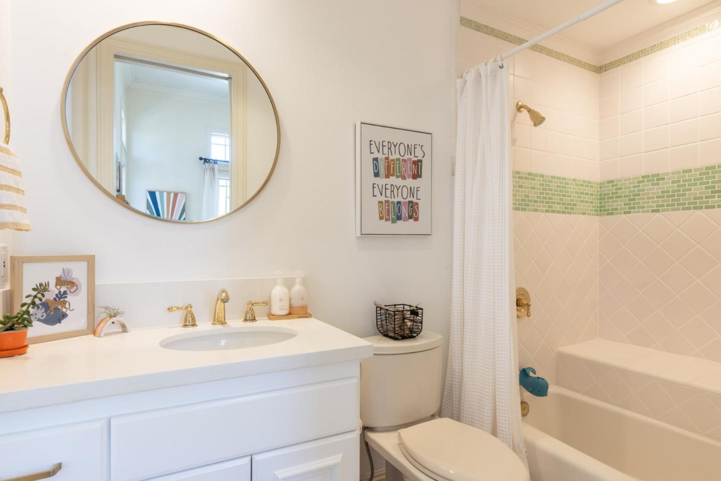 19831 Spring Ridge Terrace Salinas, CA 93908 - Photo 30 of 49 a bathroom with a sink a mirror a toilet and a bathtub