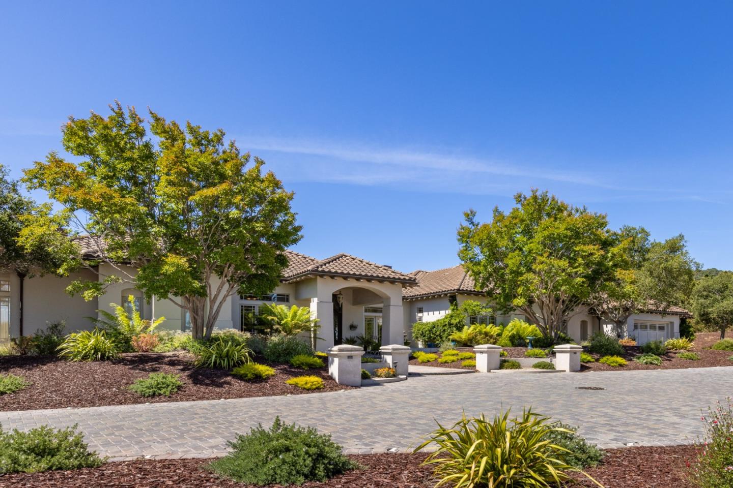 19831 Spring Ridge Terrace Salinas, CA 93908 - Photo 3 of 49 a front view of a house with a yard and potted plants